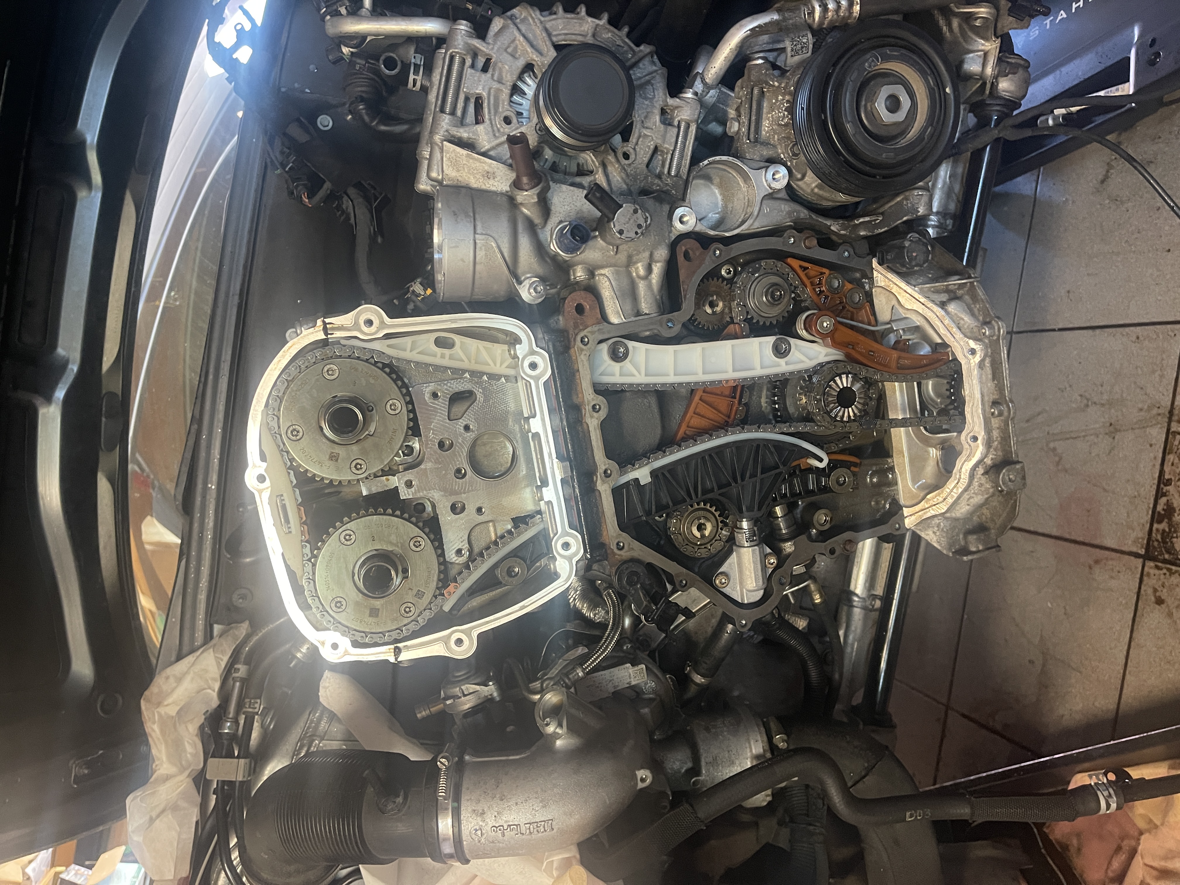 Fresh timing chain installed during reassembly, highlighting the complexity of the setup